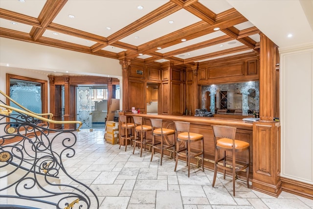 186 Kings Point Rd, Great Neck, NY 11024 - indoor wet bar with coffered ceiling, crown molding, beamed ceiling, stone tile floors, and ornate columns