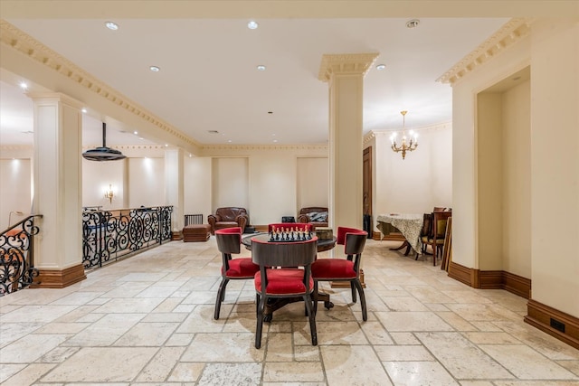 186 Kings Point Rd, Great Neck, NY 11024 - dining room with ornate columns, stone tile flooring, a chandelier, recessed lighting, and crown molding