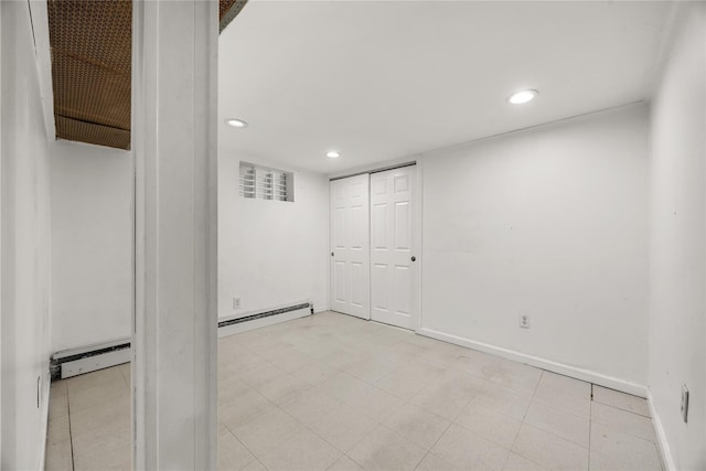 finished basement with recessed lighting, baseboards, baseboard heating, and a baseboard radiator
