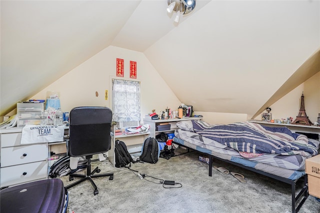 bedroom with carpet flooring and lofted ceiling