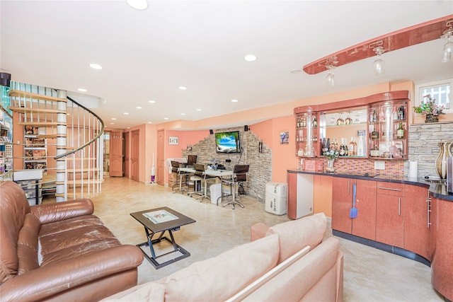 living room with recessed lighting, stairway, and bar