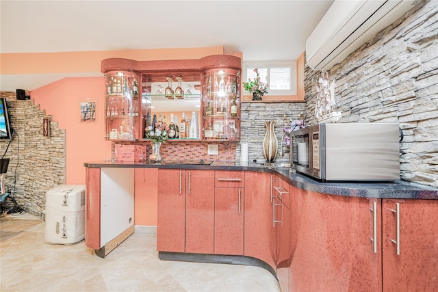bar with a wall unit AC, tasteful backsplash, indoor bar, and stainless steel microwave