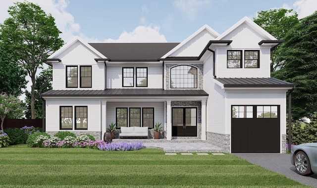 view of front of house with covered porch, a front yard, stone siding, an outdoor living space, and metal roof