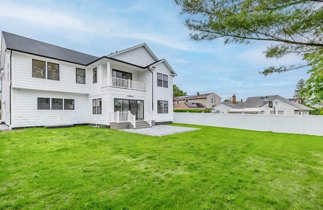 2566 Aster Pl N, Westbury, NY 11590 - back of house with a balcony and a patio area
