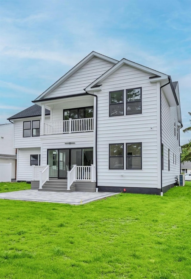 2566 Aster Pl N, Westbury, NY 11590 - rear view of property featuring a yard, a patio area, and a balcony