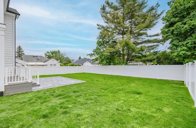 2566 Aster Pl N, Westbury, NY 11590 - fenced backyard with a patio area