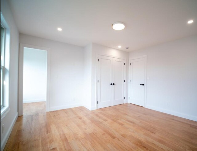 2566 Aster Pl N, Westbury, NY 11590 - unfurnished room featuring light wood-type flooring and recessed lighting
