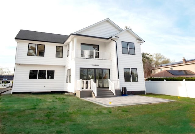 2566 Aster Pl N, Westbury, NY 11590 - rear view of property featuring a balcony and a patio