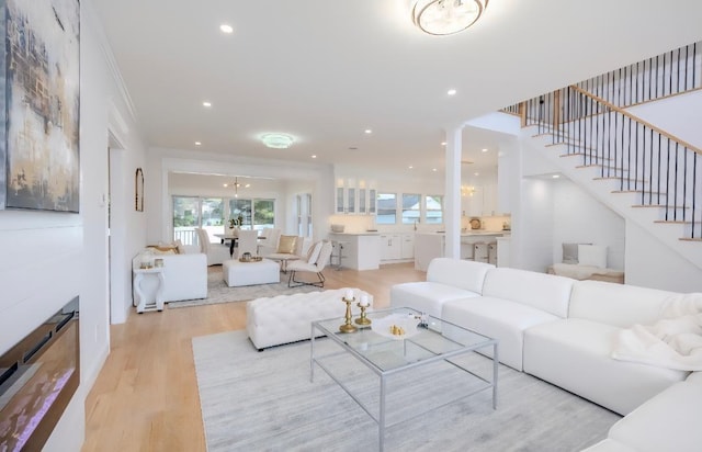 2566 Aster Pl N, Westbury, NY 11590 - living area with wood finished floors, plenty of natural light, recessed lighting, and stairway