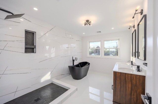 2566 Aster Pl N, Westbury, NY 11590 - bathroom featuring double vanity, a shower, a freestanding bath, and recessed lighting