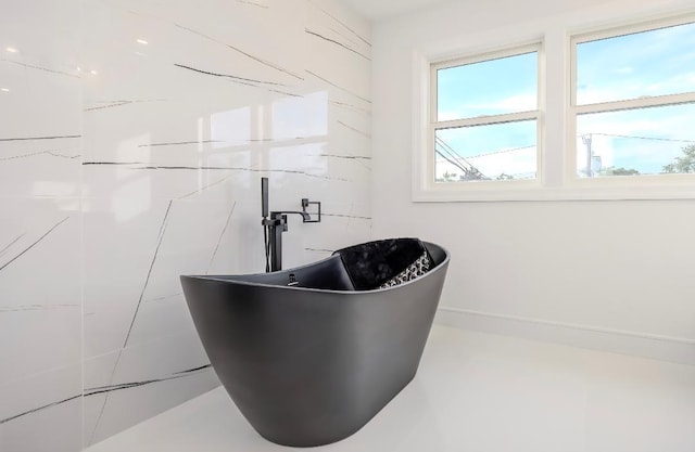 2566 Aster Pl N, Westbury, NY 11590 - bathroom view of a soaking tub and baseboards