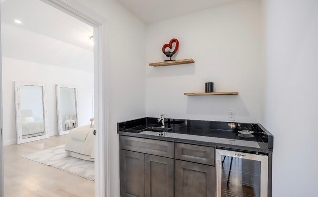 2566 Aster Pl N, Westbury, NY 11590 - indoor wet bar featuring beverage cooler and light wood-style flooring