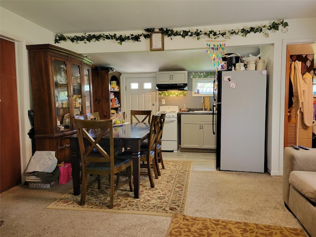 dining room with light carpet