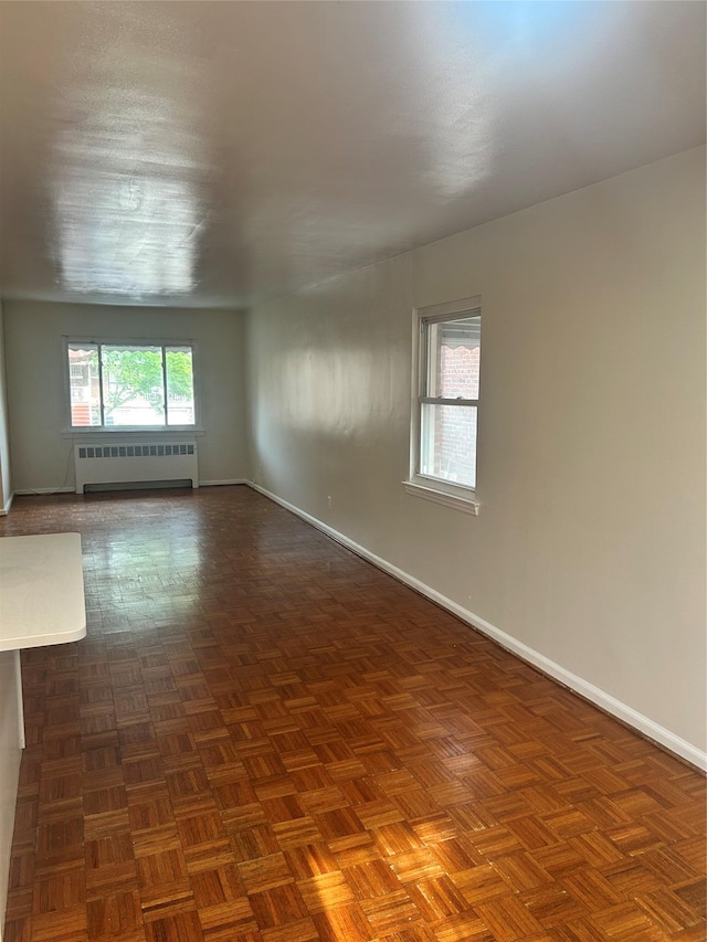 3317 Hone Ave, Bronx, NY 10469 - empty room with radiator and baseboards