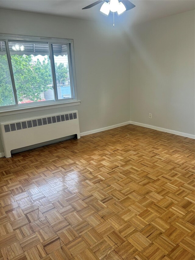 3317 Hone Ave, Bronx, NY 10469 - bonus room with radiator and a ceiling fan
