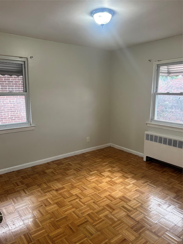 3317 Hone Ave, Bronx, NY 10469 - empty room with radiator and baseboards