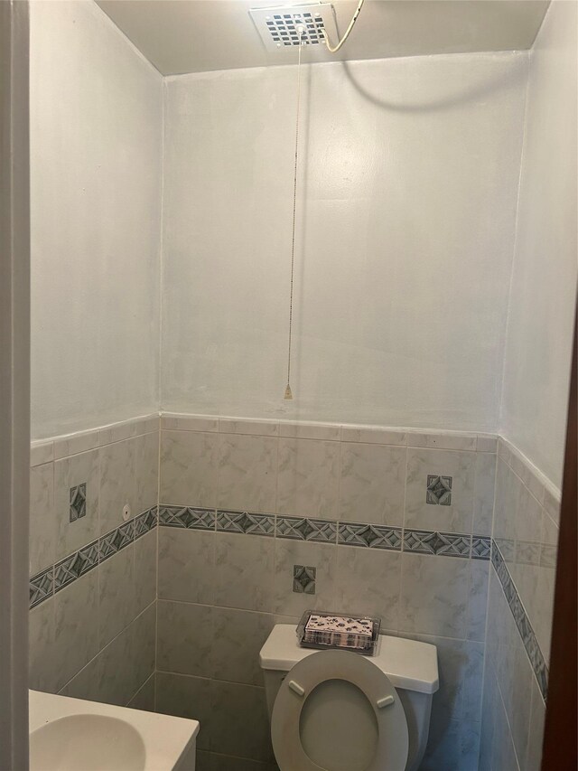 3317 Hone Ave, Bronx, NY 10469 - bathroom featuring tile walls and toilet