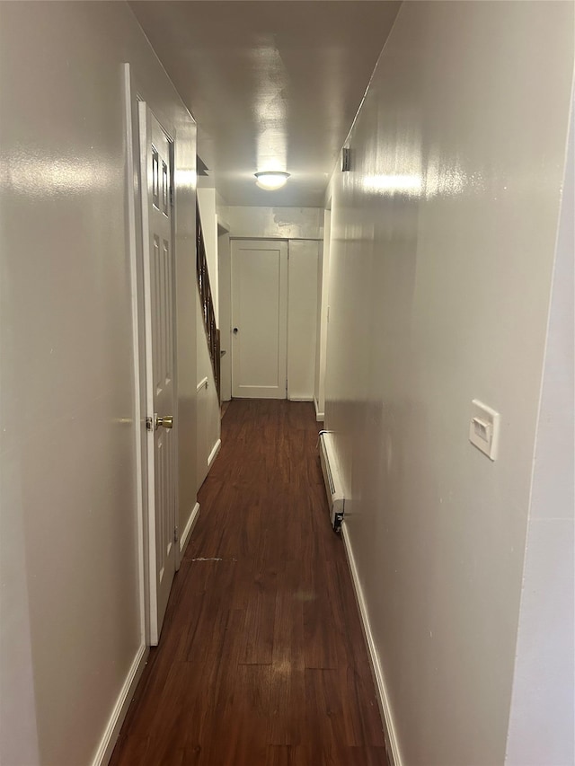 3317 Hone Ave, Bronx, NY 10469 - corridor featuring dark wood-type flooring and a baseboard radiator