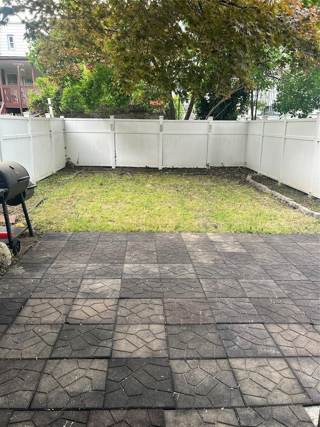 3317 Hone Ave, Bronx, NY 10469 - fenced backyard featuring a patio area and grilling area