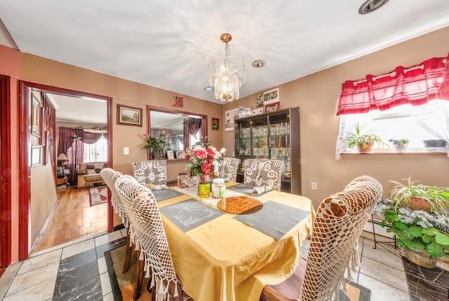 11812 Francis Lewis Blvd, Cambria Heights, NY 11411 - dining room featuring a chandelier