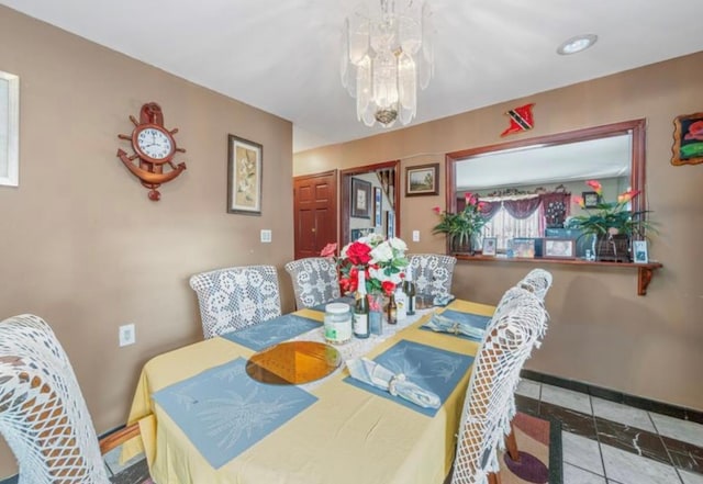 11812 Francis Lewis Blvd, Cambria Heights, NY 11411 - dining room with baseboards, a chandelier, and tile patterned flooring