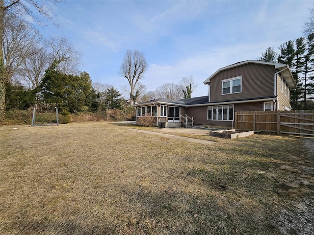 7 Raynham Rd, Glen Cove, NY 11542 - rear view of property featuring a sunroom