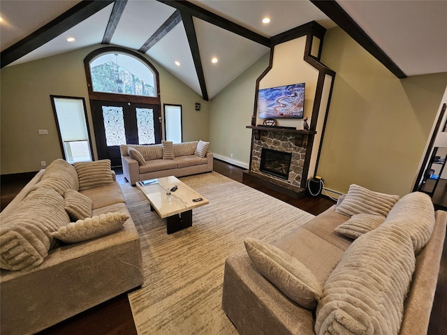 7 Raynham Rd, Glen Cove, NY 11542 - living room with wood finished floors, vaulted ceiling, a fireplace, recessed lighting, and a baseboard heating unit