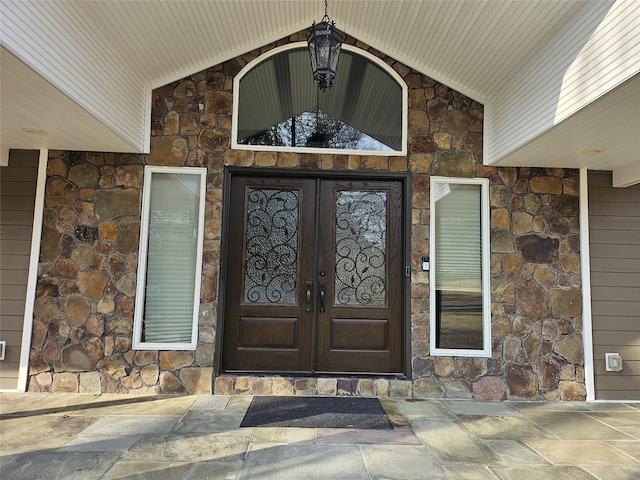 7 Raynham Rd, Glen Cove, NY 11542 - doorway to property with stone siding and french doors