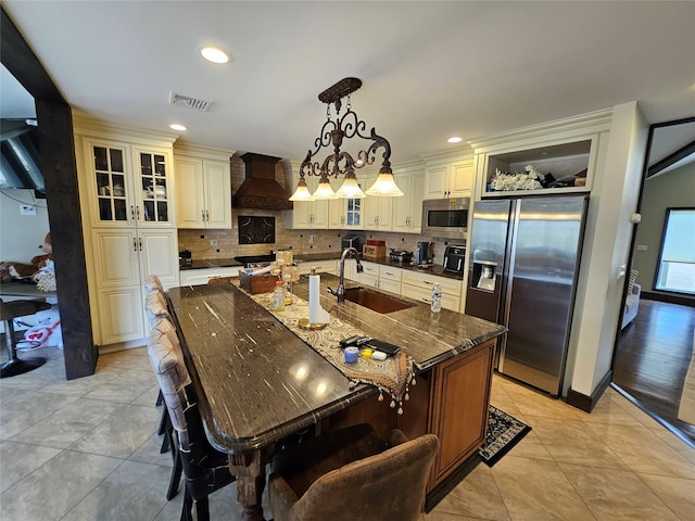7 Raynham Rd, Glen Cove, NY 11542 - kitchen with appliances with stainless steel finishes, a sink, custom exhaust hood, tasteful backsplash, and recessed lighting