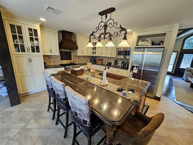 7 Raynham Rd, Glen Cove, NY 11542 - dining room featuring light tile patterned flooring and recessed lighting