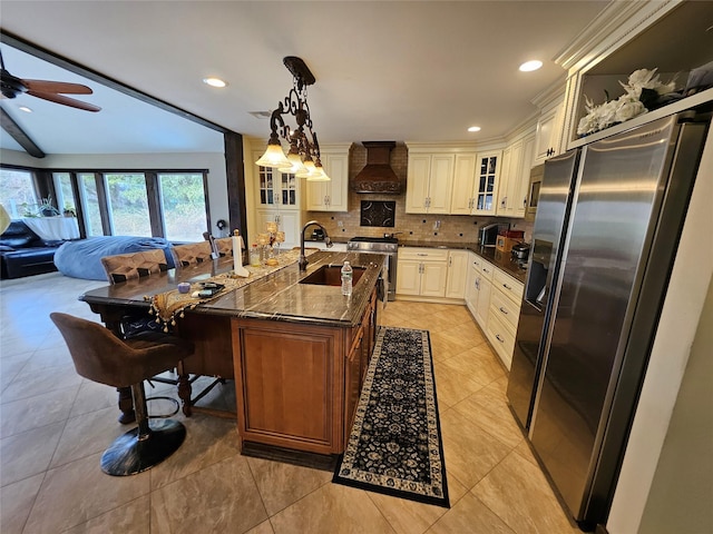 7 Raynham Rd, Glen Cove, NY 11542 - kitchen with appliances with stainless steel finishes, a sink, premium range hood, ceiling fan, and light tile patterned flooring