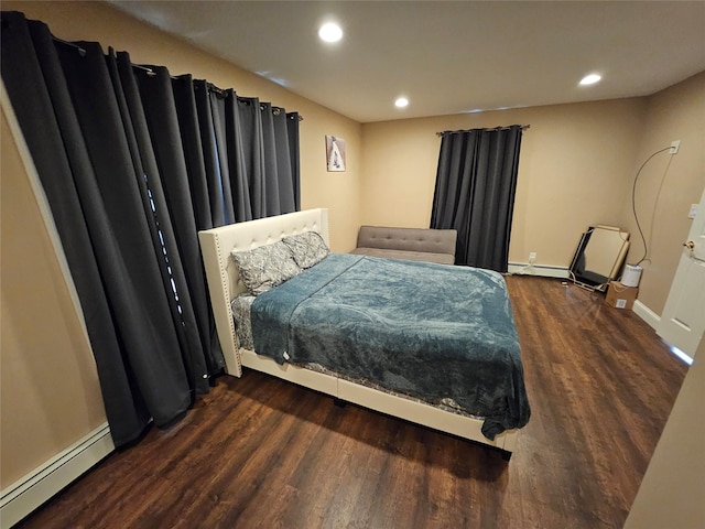 7 Raynham Rd, Glen Cove, NY 11542 - bedroom with baseboard heating, wood finished floors, baseboards, and recessed lighting