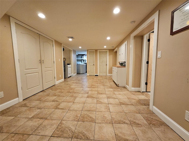 7 Raynham Rd, Glen Cove, NY 11542 - kitchen with white cabinets, recessed lighting, baseboards, washer / clothes dryer, and light countertops