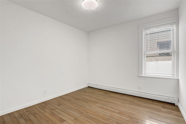 48-35 Clearview Expy, Bayside, NY 11364 - unfurnished room with baseboard heating and hardwood / wood-style flooring