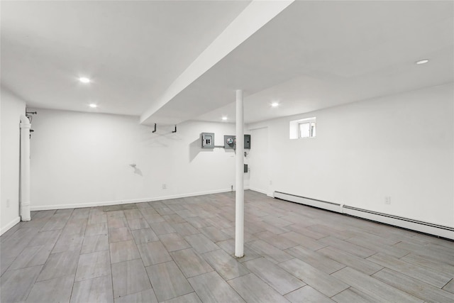48-35 Clearview Expy, Bayside, NY 11364 - below grade area with recessed lighting, baseboard heating, electric panel, and wood finished floors