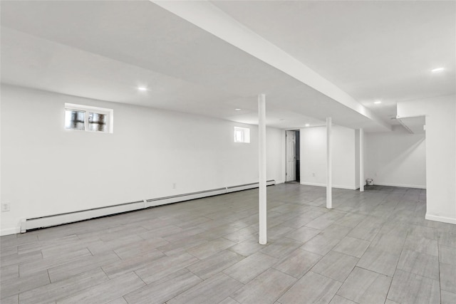 48-35 Clearview Expy, Bayside, NY 11364 - basement with a baseboard heating unit, recessed lighting, and light wood finished floors