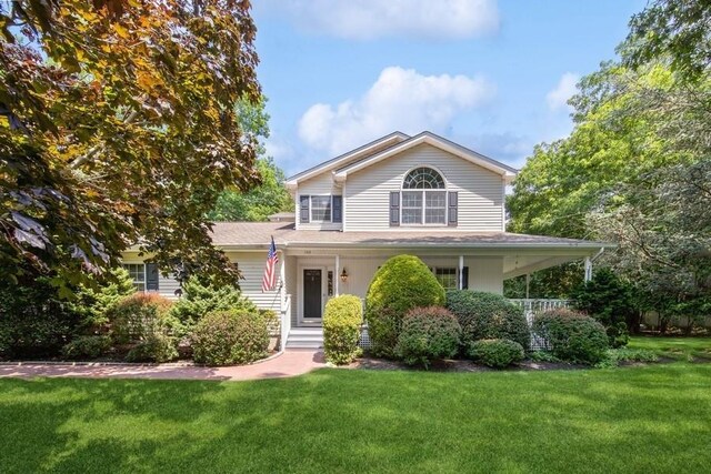 735 Deerfoot Path, Cutchogue, NY 11935 - view of front of house with a front lawn and covered porch