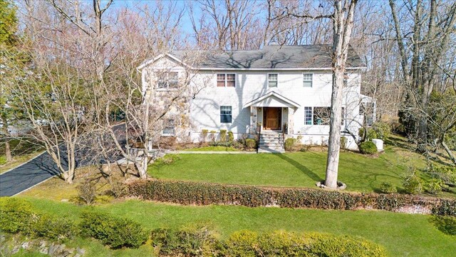 colonial house with a front lawn