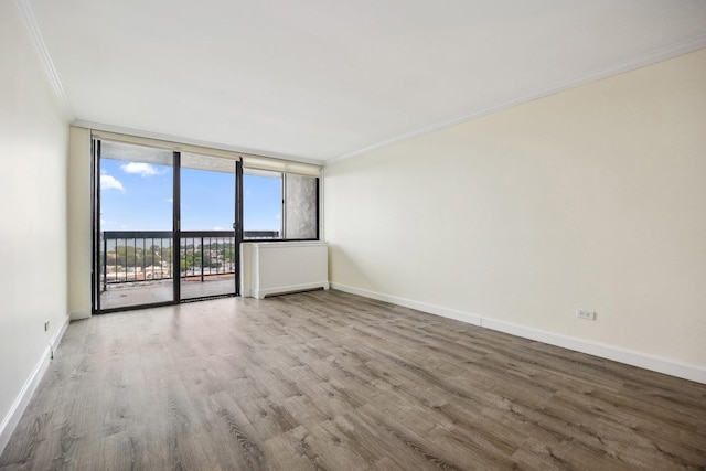 2 Bay Club Dr Unit 17Z2, Bayside, NY 11360 - unfurnished room featuring ornamental molding, wood finished floors, and expansive windows