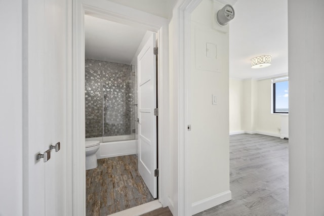 2 Bay Club Dr Unit 17Z2, Bayside, NY 11360 - bathroom featuring bath / shower combo with glass door and wood finished floors