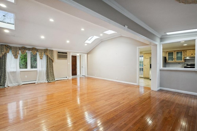 unfurnished living room with baseboards, a wealth of natural light, light wood-type flooring, and ornamental molding