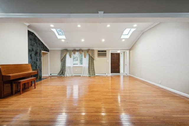 unfurnished living room with baseboards, vaulted ceiling with skylight, light wood-type flooring, and crown molding