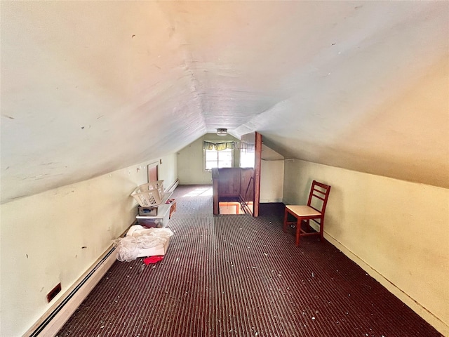 bonus room featuring a baseboard heating unit, carpet flooring, and lofted ceiling