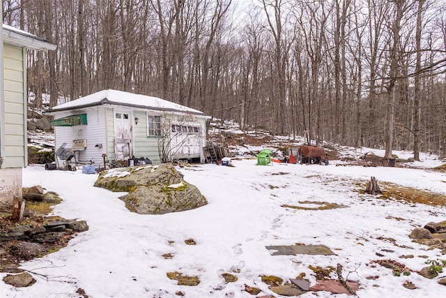 snowy yard with an outdoor structure