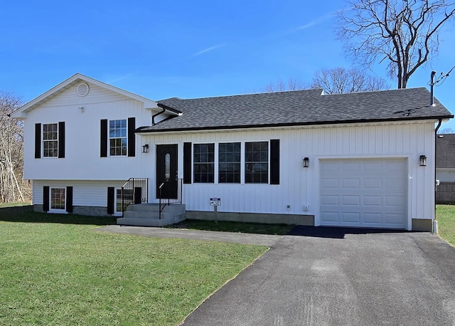 68 Ostend Cir, Shirley, NY 11967 - split level home featuring aphalt driveway, a garage, roof with shingles, and a front lawn