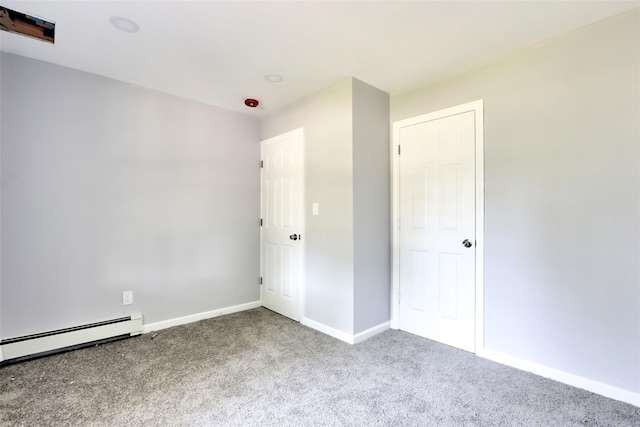 17 Windmill Ln, Levittown, NY 11756 - unfurnished bedroom with baseboards, baseboard heating, and carpet floors
