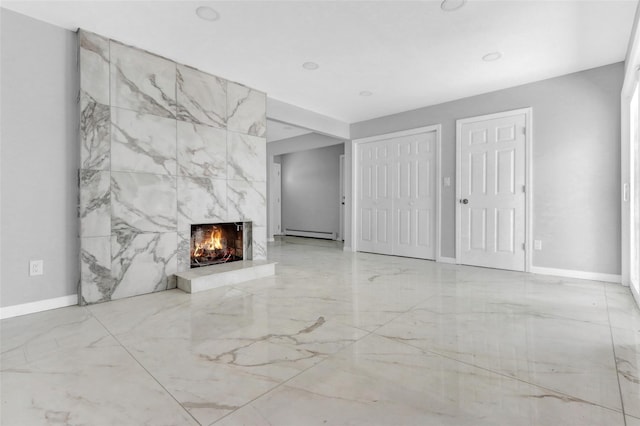 17 Windmill Ln, Levittown, NY 11756 - unfurnished living room featuring marble finish floor, baseboards, baseboard heating, and a high end fireplace