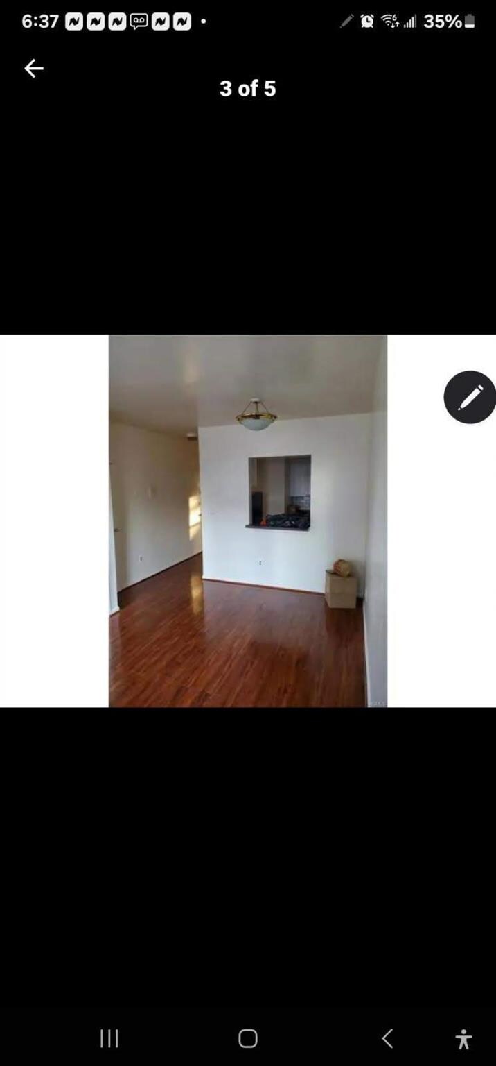 1680 Monroe Ave, Bronx, NY 10457 - unfurnished living room with wood finished floors
