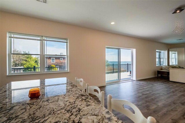 125 S Bay Dr, Babylon, NY 11702 - dining room with dark wood-style flooring, baseboards, and recessed lighting