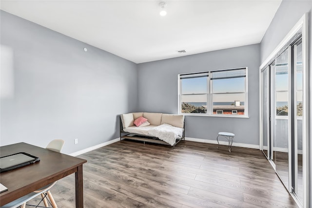125 S Bay Dr, Babylon, NY 11702 - living area featuring wood finished floors, baseboards, and an office area